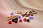 generate a modern product image displaying the following individual notes, with a pink/beige/taupe background: berries, hay, violet, sandalwood, vanilla, tonka bean