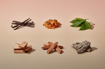 generate a modern product image displaying the following individual notes, with a pink/beige/taupe background: vanilla, amber, patchouli, sandalwood, cedar, oak